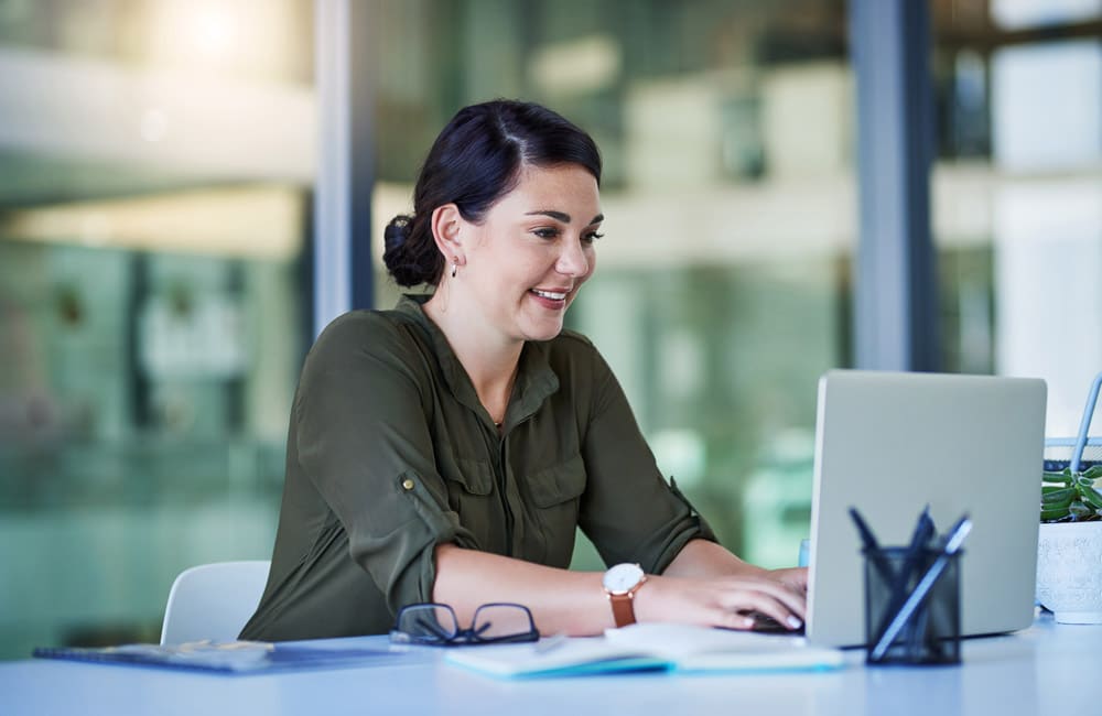 A lawyer sitting at their computer conducting legal research for a case.