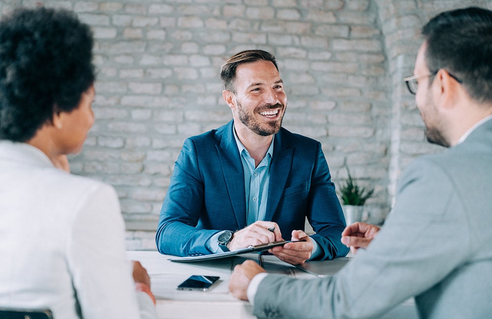 Lawyer meeting with clients in their office